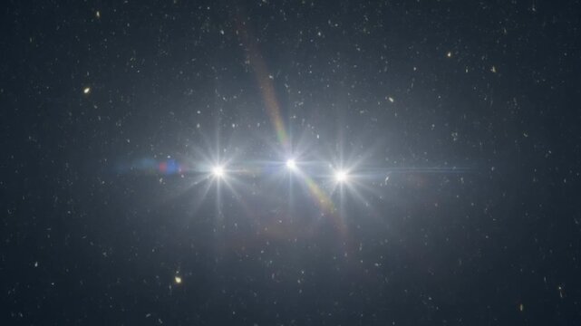 Triple starburst lens flare overlay with floating dust particles on dark background
