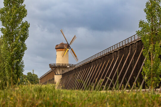The historic and restored windmill tower with his new sails between the graduation towers IV and V in the spa town of Bad Nauheim, Hesse, Germany