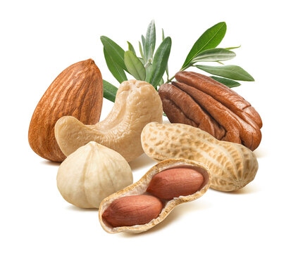 Almond, cashew; hazelnut;,peanut, pecan nuts and green leaves isolated on white background.  Real photography