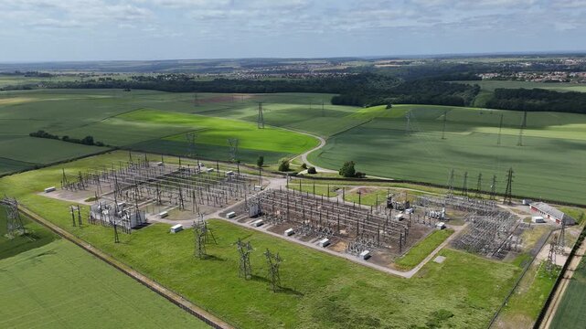 Centrale &eacute;lectrique en milieu rural. vue a&eacute;rienne des installations &eacute;lectriques, transformateurs, pyl&ocirc;nes, et cables. Meurthe-et-Moselle, Lorraine France