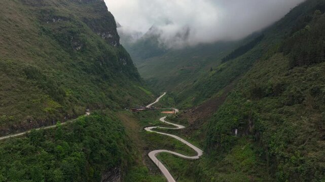 Aerial View Of the Winding Tham Ma Mountain Pass In Ha Giang Province In Vietnam - Ha Giang Loop Drone Shot at Sunset.