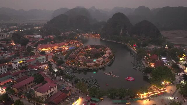 Aerial view of Tam Coc, a Historic Old Town Island in evening, Surrounded by Carst Mountains in Ninh Binh, Vietnam.