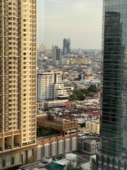 Naklejka premium Bangkok Cityscape Framed Between High-Rise Skyscrapers