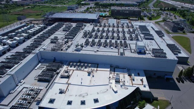 Aerial view of data center with ventilators, advanced technology cooling systems, HVAC at data center rooftop, cooling infrastructure for server operations