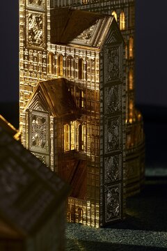 Hyper realistic impossibly tall and complex house of playing cards