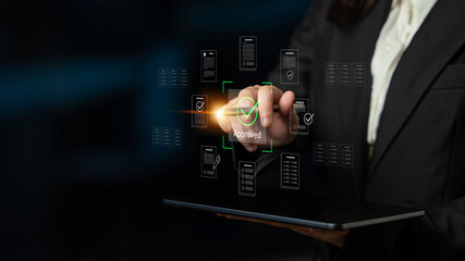 A business professional interacts with a tablet displaying digital approval graphics, symbolizing...