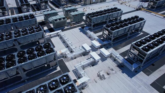 Aerial view of data center with ventilators, advanced technology cooling systems, HVAC at data center rooftop, cooling infrastructure for server operations