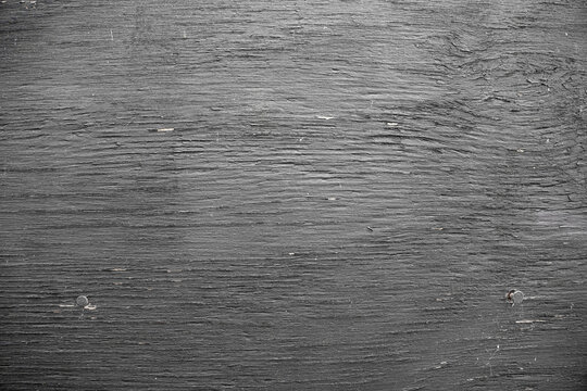 Horizontal black wood texture background with weathered grain and nail heads