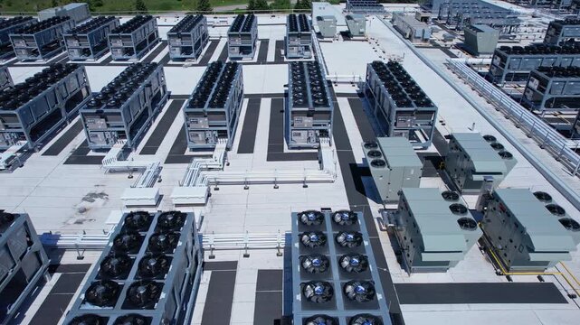 Aerial view of data center with ventilators, advanced technology cooling systems, HVAC at data center rooftop, cooling infrastructure for server operations