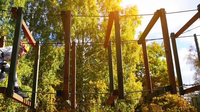 Girl climbing in adventure park