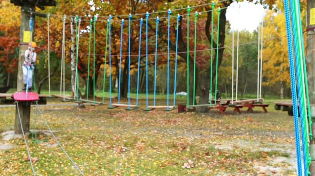 Girl climbing in adventure park