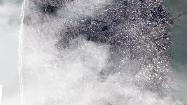 Flying Over San Francisco Toward Golden Gate Bridge with Passing Clouds from Space