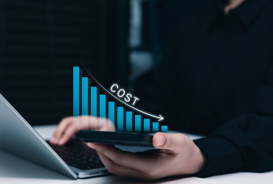Cost reduction and business expense optimization concept. person holding smartphone with decreasing bar chart, downward cost arrow, and laptop. budget control, savings, efficiency, financial planning