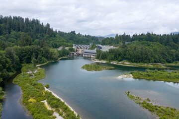 Obraz premium Hydroelectric Dam and River Surrounded by Forested Hills Near Mission, BC, Canada