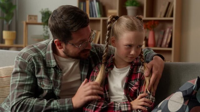 Family quarrel offended Caucasian child little girl man dad apologizing at home kid avoid ignoring guilty male guy asking forgiveness sorry caring parent father apology touch daughter stress conflict