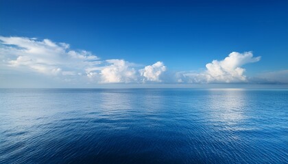 Obraz premium Clear Blue Sky With Clouds Over Calm Water