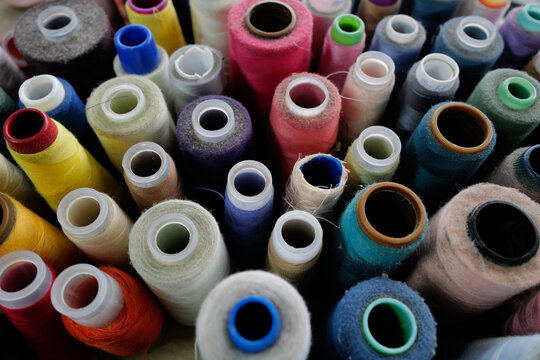Abstract image of colorful spools of thread used in a local embroidery shop