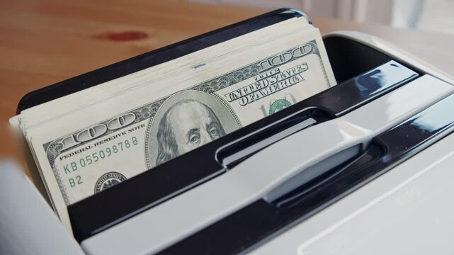 As the sun streams through the window, a sleek printer efficiently churns out clear copies of important papers, showcasing a smooth workflow in a bright workspace