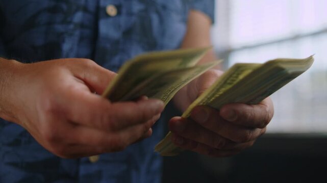 In a bright, cozy space, hands carefully sort stacks of cash, feeling the texture of each bill. The atmosphere is filled with anticipation and a sense of possibility