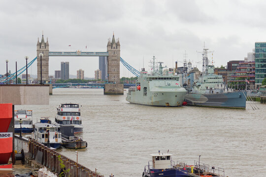 Royal Canadian Navy vessel HMCS William Hall (left) is moored next to HMS Belfast in front of Tower Bridge in London