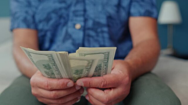 In a sunny room, a person carefully counts a stack of cash, feeling the crisp bills in their hands while enjoying the serenity of the moment