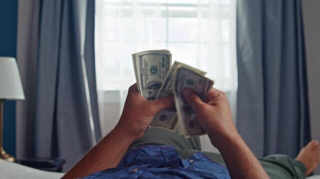 Fingers sift through crisp bills as sunlight streams in, casting a warm glow in this inviting space. A moment of anticipation fills the air