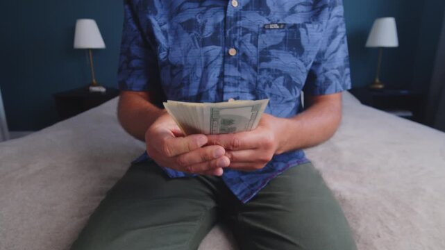 A person sits on a soft bed in a bright room, carefully counting bills with a smile. The warm sunlight filters through, creating a peaceful atmosphere