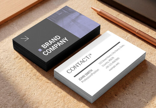 Stack of business cards mockup with pen on desk