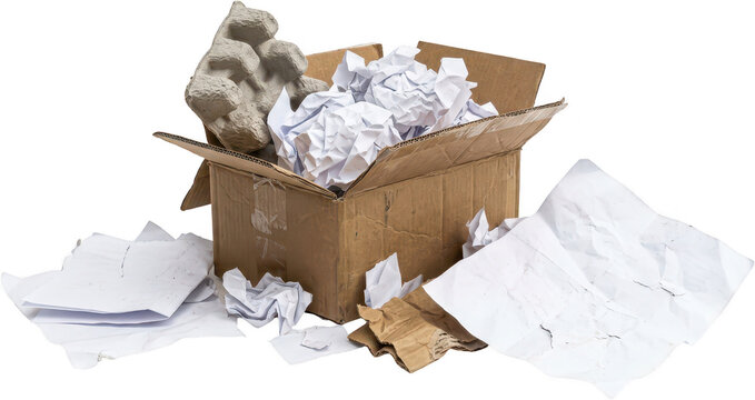 Cardboard box filled with crumpled white paper and gray egg carton material surrounded by scattered paper debris and torn cardboard recycling waste trash garbage