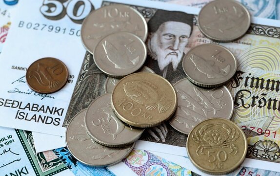 Icelandic krona money bills and coins on table. Iceland cash of ISK currency close up