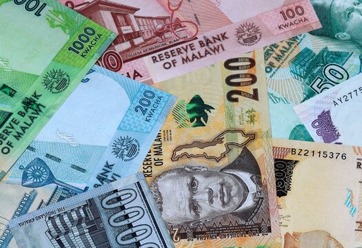 Malawian kwacha money banknotes bunch on table. Malawi bills of MWK currency