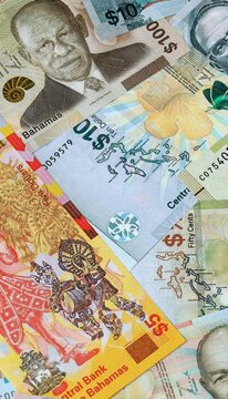 Bahamian dollar money banknotes bunch on table. Bahamas bills of BSD currency close up