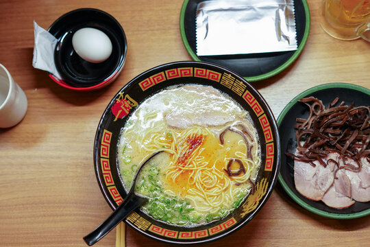 Tokyo, Japan - August 30, 2025: Bowl of tonkotsu ramen served at Ichiran Ramen restaurant in Shibuya, Tokyo. Ichiran is a popular Japanese ramen chain known for individual dining booths