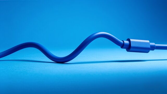 Wavy blue charging cable and connector plug on solid blue background
