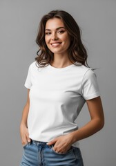 Obraz premium Smiling young woman in white t-shirt standing against grey background. Casual fashion portrait of girl with long wavy hair. Studio shot for lifestyle branding and clothing advertisement.