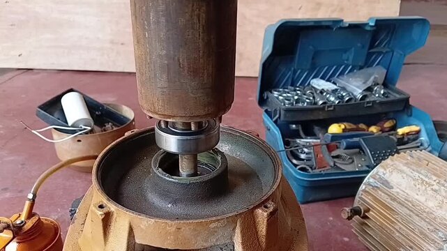 Inserting Rotor And New Bearing Into Front Endshield With Wet Epoxy For Centering And Temporary Fix