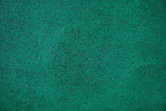 Solid green textured surface with even color and smooth appearance