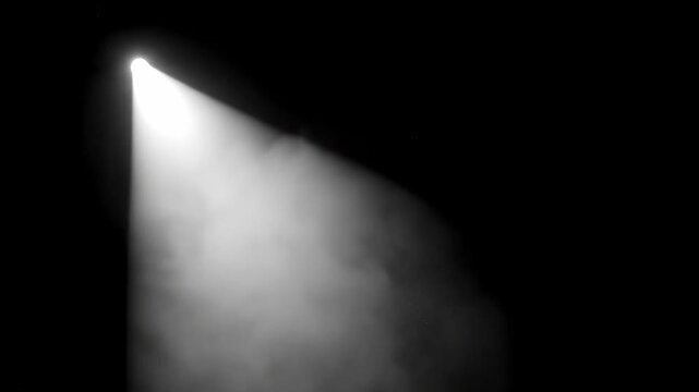 Dramatic Spotlight Beam with White Light and Smoke on Black Background, ideal for cinematic stage intros and dramatic video overlays.