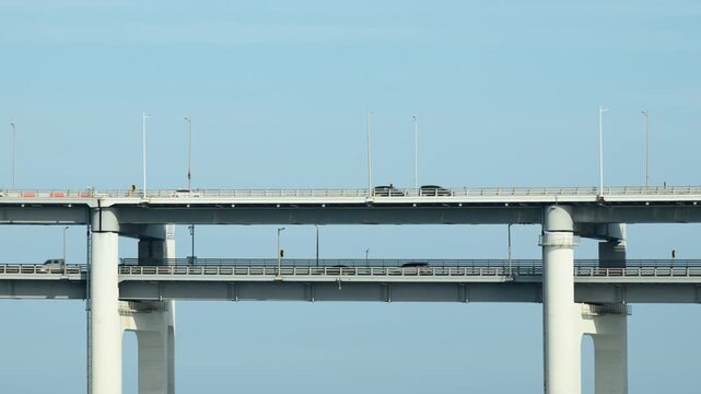 Daytime Timelapse of a Two-Level Section of Gwangan Bridge with Traffic Against Blue Sky