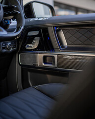 Fototapeta premium Luxurious car interior with leather dashboard ambient lighting.