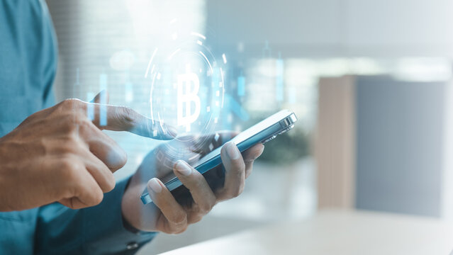 Business user managing cryptocurrency transactions on a smartphone with digital coin interface, representing blockchain technology, digital finance, crypto assets, mobile payments.