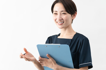 Fototapeta premium エステサロン制服を着た若い女性 ビューティイメージ