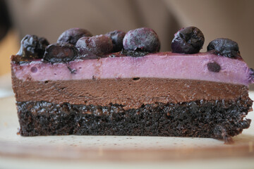 Chocolate and berry dessert on a plate with fruits on top © Towfiqu Barbhuiya 