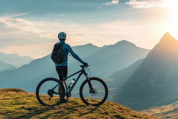 Fototapeta premium Biker cycling on alpine summit at sunset with majestic mountain landscape adventure