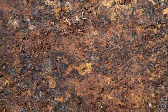 Porous laterite rock surface texture with natural reddish brown color