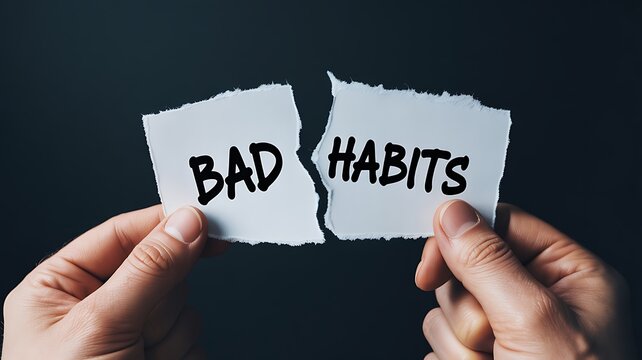 Person tearing bad habits message symbolizing self improvement and positive change
