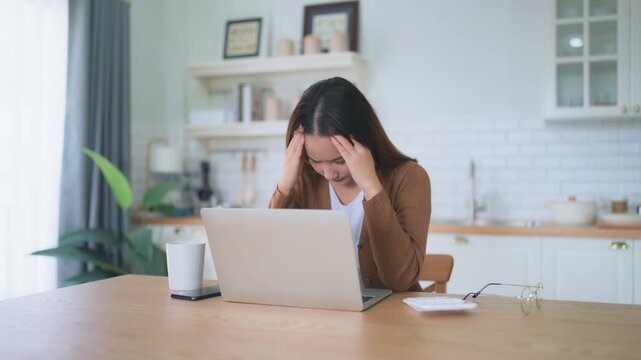 Office syndrome. Overworked tired young asian woman feeling headache, having eyesight problem after computer laptop work. Stressed young woman suffering from fatigue at home