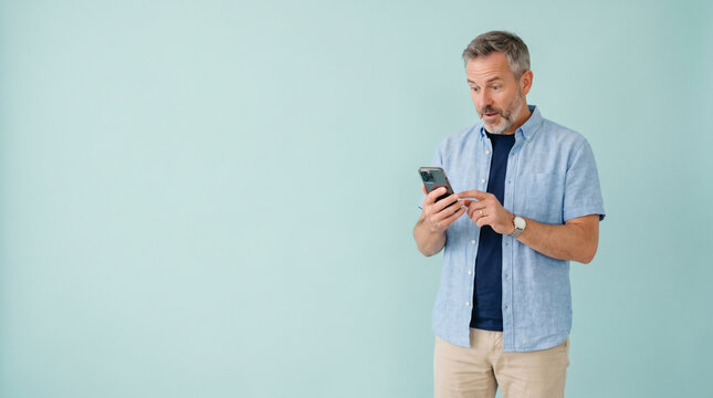 Middle Aged Man Reacting to Smartphone Notification
