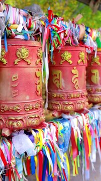 A close-up of prayer wheels khurde . An attribute of Buddhist rituals. Buryatia, Arshan, Russia.