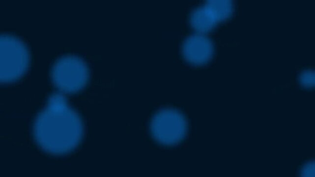 Abstract blue glowing orbs floating in dark space with soft bokeh light effects